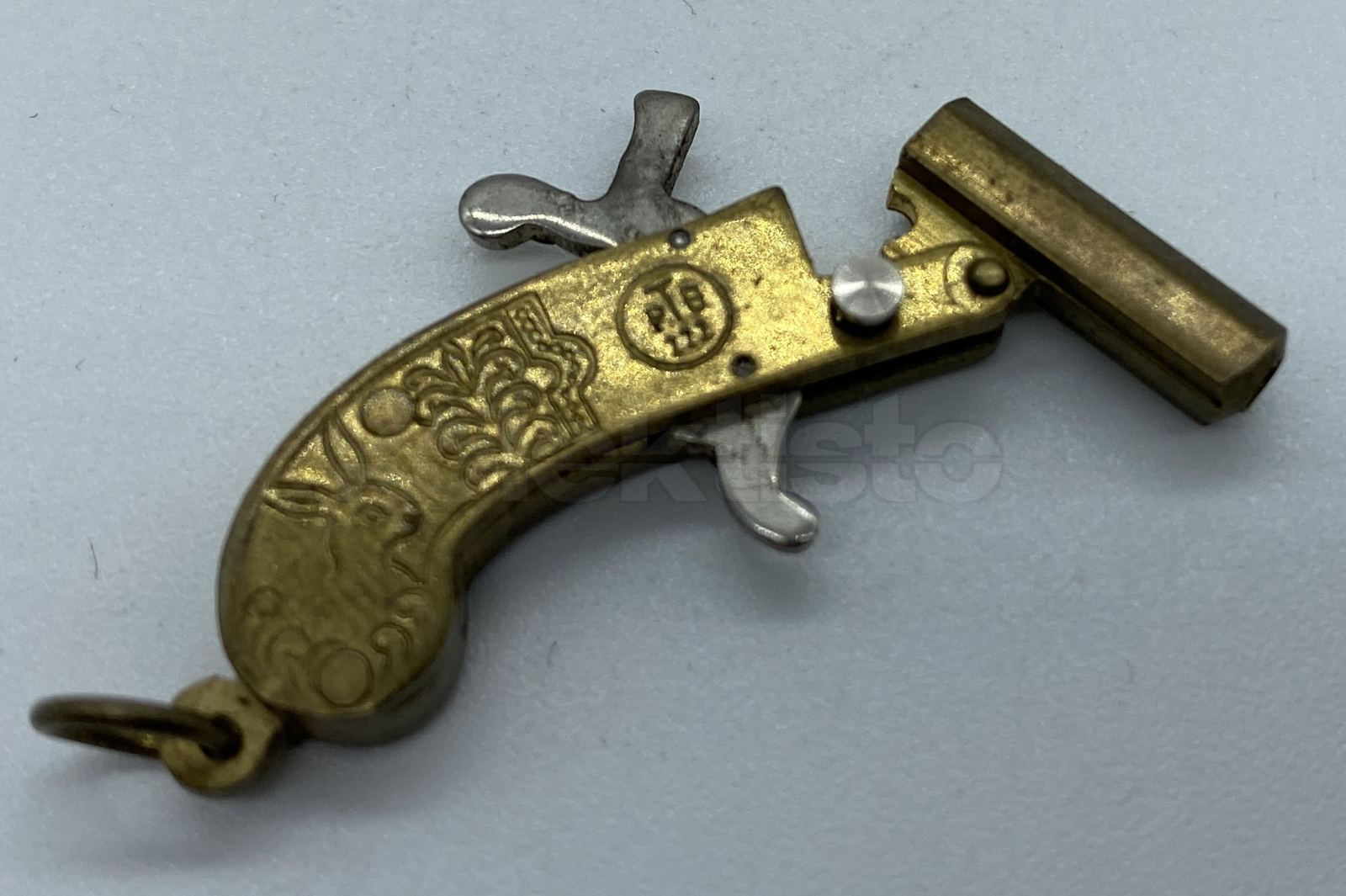 Miniaturní pistolka zn. AUSTRIA č.2