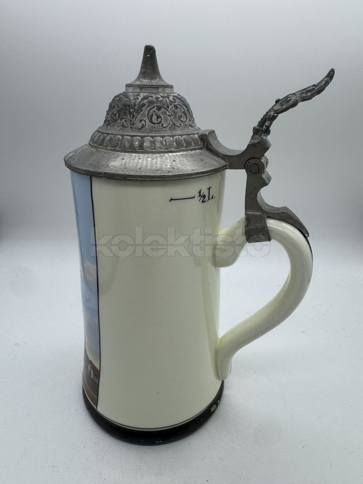 Porcelánový korbel z města ULM s průsvitkou na dně