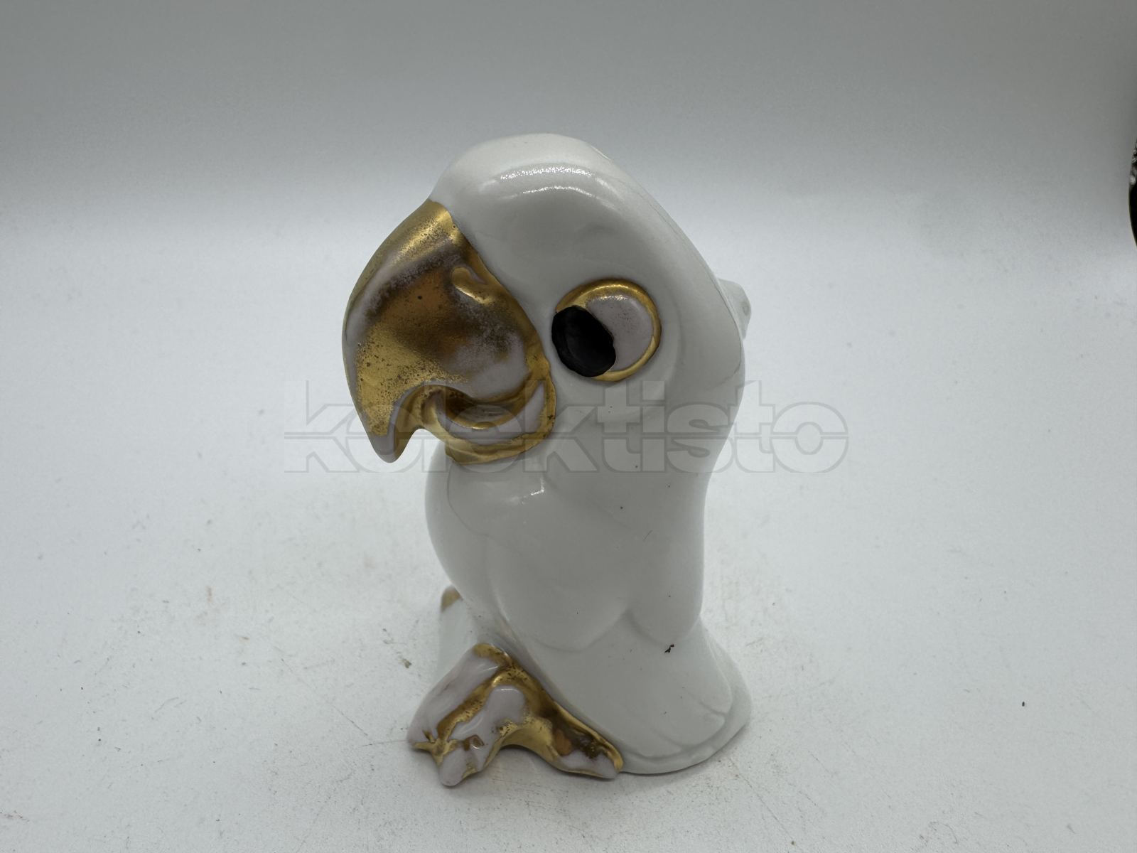 Porcelánová slánka papoušek