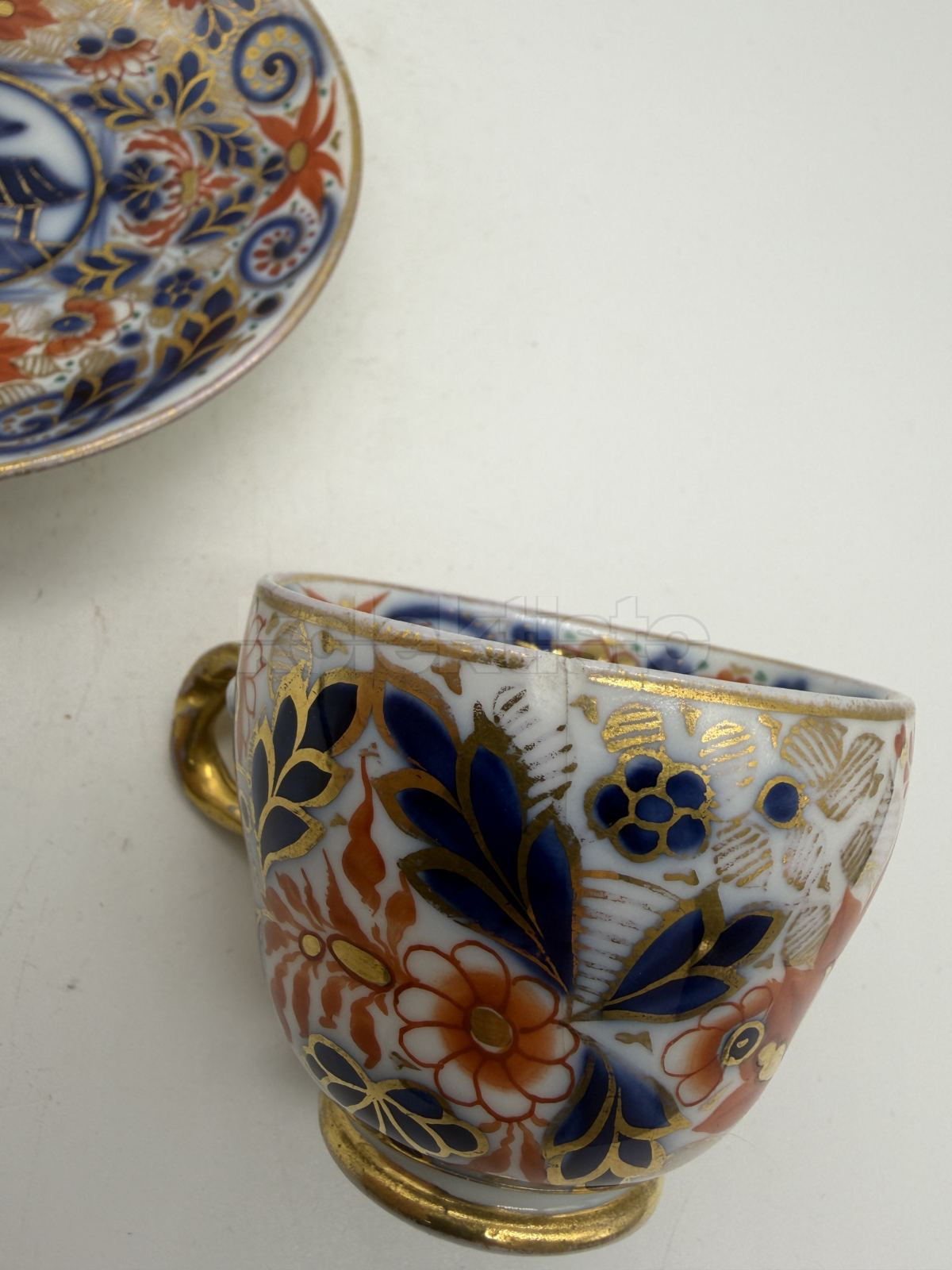 Porcelánový šálek s podšálkem