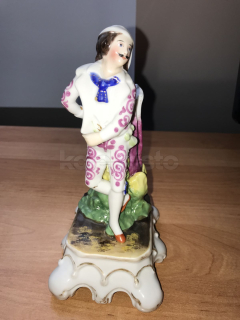 Porcelánová svícen Muž