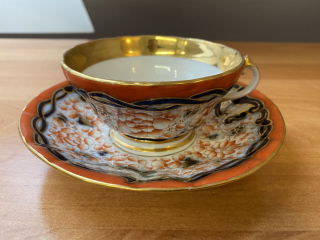 Porcelánový šálek s podšálkem